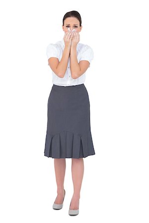 Upset businesswoman blowing her nose while posing on white background Stock Photo - Budget Royalty-Free & Subscription, Code: 400-06955195