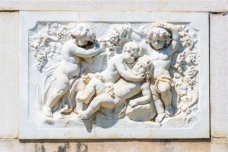 simsearch:400-05338054,k - Ornamental allegoric bas-relief sculpture with babies in white marble on Peles castle wall in Sinaia, Romania. Stock Photo - Budget Royalty-Free & Subscription, Code: 400-06952377