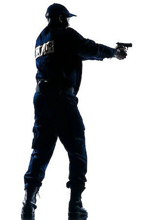 Full length of an Afro American police officer aiming a handgun on white isolated background Stock Photo - Budget Royalty-Free & Subscription, Code: 400-06952702