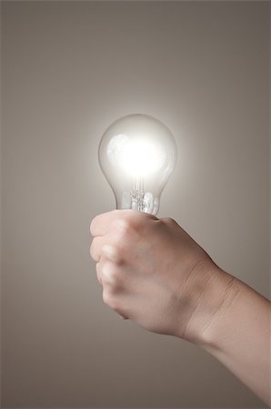 simsearch:400-04265413,k - Hand holding a glowing light bulb Stock Photo - Budget Royalty-Free & Subscription, Code: 400-06953102