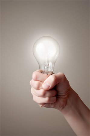 simsearch:400-04265413,k - Hand holding a glowing light bulb Stock Photo - Budget Royalty-Free & Subscription, Code: 400-06953121