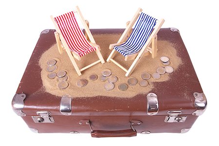 Vintage suitcase with One and two euro coins lie in front of toy beach chairs Stock Photo - Budget Royalty-Free & Subscription, Code: 400-07039004