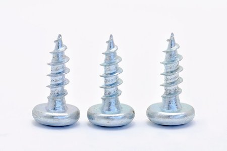 simsearch:400-05240852,k - Three galvanized steel screw on white background Stock Photo - Budget Royalty-Free & Subscription, Code: 400-07047727