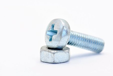 simsearch:400-05240852,k - Galvanized steel screw with a nut screwed on a white background Stock Photo - Budget Royalty-Free & Subscription, Code: 400-07047729