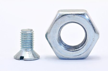 simsearch:400-05240852,k - Galvanized steel screw with a nut screwed on a white background Stock Photo - Budget Royalty-Free & Subscription, Code: 400-07047730