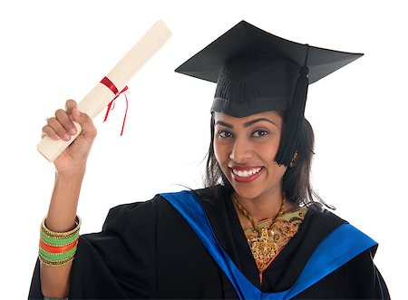 school india - Happy Indian adult student in graduation gown and cap holding diploma certificate. Portrait of mixed race Asian Indian and African American female model standing isolated on white background. Stock Photo - Budget Royalty-Free & Subscription, Code: 400-07048909