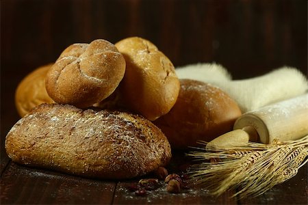 Fresh Baked Bread on Wooden Background Stock Photo - Budget Royalty-Free & Subscription, Code: 400-07049559
