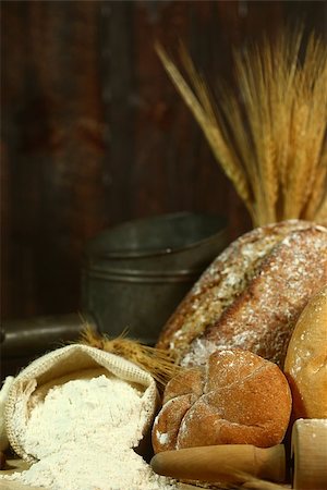 Fresh Baked Bread on Wooden Background Stock Photo - Budget Royalty-Free & Subscription, Code: 400-07049552