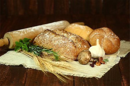 Fresh Baked Bread on Wooden Background Stock Photo - Budget Royalty-Free & Subscription, Code: 400-07049560