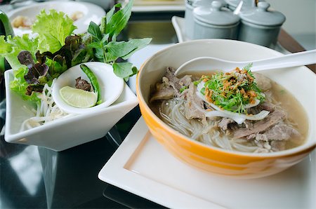 Pho Lao style noodle soup with vegetables on table Stock Photo - Budget Royalty-Free & Subscription, Code: 400-07040058
