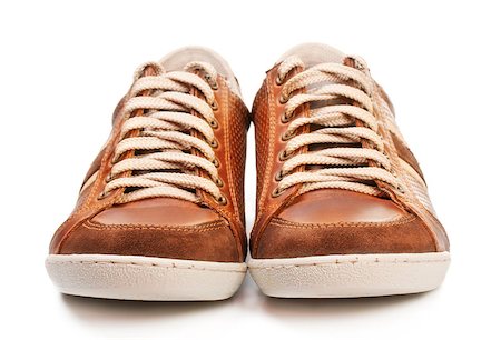 simsearch:400-07922607,k - brown leather trainer shoe isolated on white Stock Photo - Budget Royalty-Free & Subscription, Code: 400-07041158