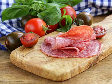 simsearch:400-06207145,k - smoked sausage, tomatoes and basil on a wooden cutting board Stock Photo - Budget Royalty-Free & Subscription, Code: 400-07055677