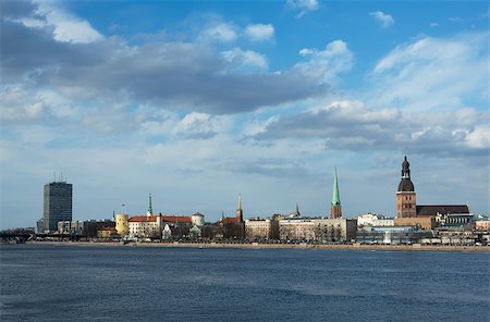 simsearch:400-07111236,k - This is the view of Riga (latvia) in day. Daugava river is in the foreground, modern and historic buildings are in the background. Stock Photo - Budget Royalty-Free & Subscription, Code: 400-07056513