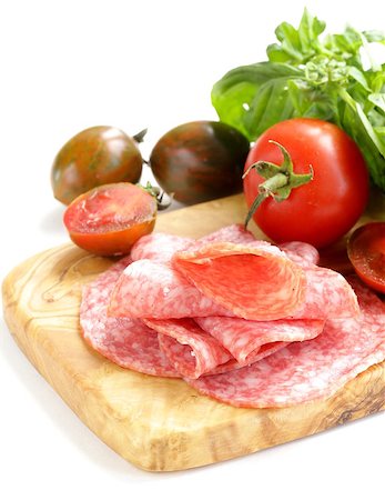 simsearch:400-06207145,k - smoked sausage, tomatoes and basil on a wooden cutting board Stock Photo - Budget Royalty-Free & Subscription, Code: 400-07056808