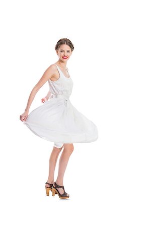 simsearch:400-04722731,k - Happy pretty woman in white summer dress posing on white background Stock Photo - Budget Royalty-Free & Subscription, Code: 400-07058408