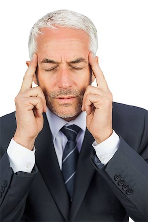 simsearch:400-04283915,k - Focused mature businessman holding his temples on white background Stock Photo - Budget Royalty-Free & Subscription, Code: 400-07059356