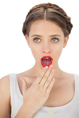 simsearch:400-05027723,k - Amazed model in white dress posing covering her mouth on white background Stock Photo - Budget Royalty-Free & Subscription, Code: 400-07059885