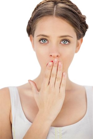 simsearch:400-05027723,k - Surprised model in white dress posing covering her mouth on white background Stock Photo - Budget Royalty-Free & Subscription, Code: 400-07059883