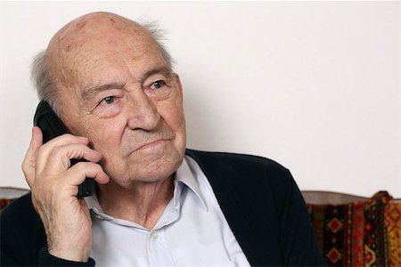 Portrait of an old senior man with a telephone Stock Photo - Budget Royalty-Free & Subscription, Code: 400-07052098