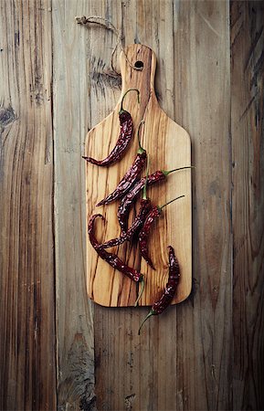 simsearch:628-02228100,k - Dried chili peppers on wooden kitchen board Stock Photo - Budget Royalty-Free & Subscription, Code: 400-07052280