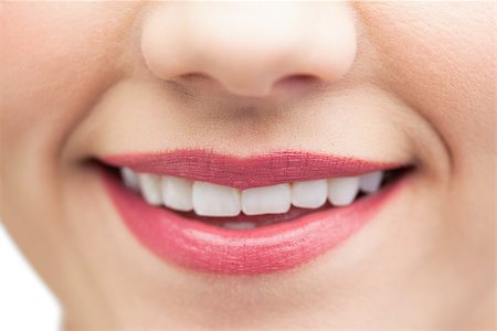 simsearch:400-04135676,k - Extreme close up on beautiful white smile wearing pink lipstick Stock Photo - Budget Royalty-Free & Subscription, Code: 400-07060445