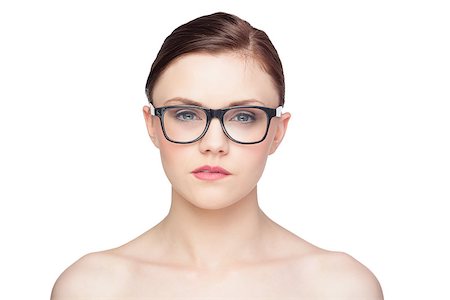 simsearch:614-01179436,k - Pensive natural model wearing classy glasses on white background Stock Photo - Budget Royalty-Free & Subscription, Code: 400-07060484
