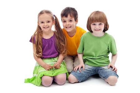 Happy kids sitting on the floor smiling - isolated Stock Photo - Budget Royalty-Free & Subscription, Code: 400-07086827