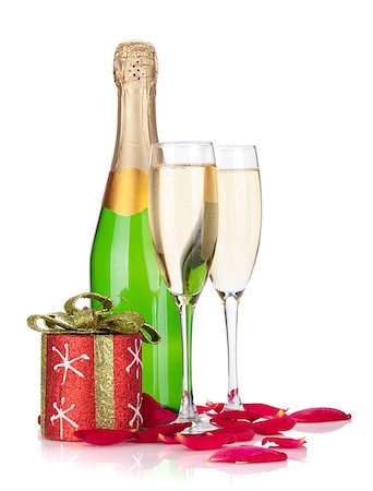 simsearch:400-07166551,k - Two champagne glasses, christmas decor and rose petals. Isolated on white background Stock Photo - Budget Royalty-Free & Subscription, Code: 400-07088987