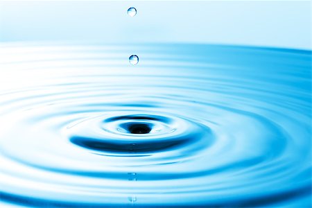 simsearch:622-07519538,k - Droplet falling in blue water Stock Photo - Budget Royalty-Free & Subscription, Code: 400-07089017