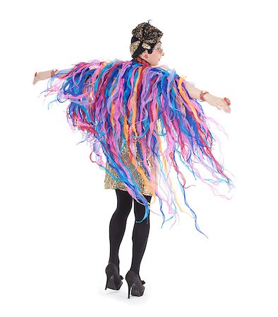 Fashion conscious drag queen in a glitzy gold dress, high heeled stilettos and with streamers performing in a show, isolated on white Foto de stock - Super Valor sin royalties y Suscripción, Código: 400-07089500