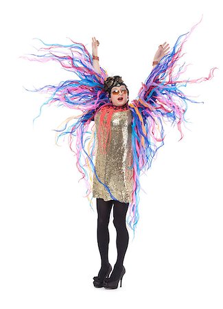 Fashion conscious drag queen in a glitzy gold dress, high heeled stilettos and with streamers performing in a show, isolated on white Foto de stock - Super Valor sin royalties y Suscripción, Código: 400-07089501