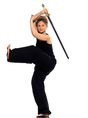 female white background full body - mature woman praticing tai chi chuan with sword in studio on isolated white background Stock Photo - Budget Royalty-Free & Subscription, Code: 400-07095539