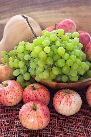 simsearch:400-07096505,k - Autumnal organic ripe fruits and veg - green grape, red apples and pumpkin on wooden background Stock Photo - Budget Royalty-Free & Subscription, Code: 400-07096508