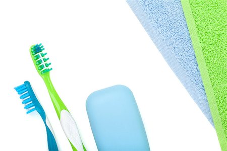Toothbrushes, soap and towels. Isolated on white background Photographie de stock - Aubaine LD & Abonnement, Code: 400-07098522