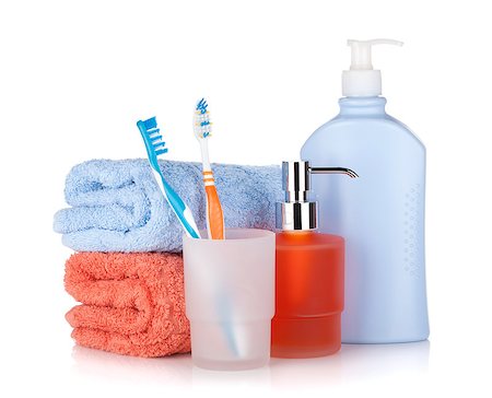 Toothbrushes, shampoo bottles and two towels. Isolated on white background Photographie de stock - Aubaine LD & Abonnement, Code: 400-07090522