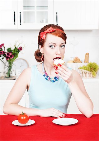 simsearch:400-05106591,k - Beautiful woman eating cake on the kitchen Stock Photo - Budget Royalty-Free & Subscription, Code: 400-07090848