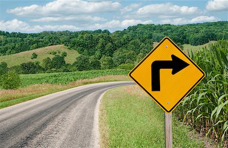 A sign warns of a sharp right turn on a country road in southern Wisconsin. Stock Photo - Budget Royalty-Free & Subscription, Code: 400-07092293