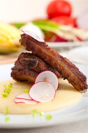 spare - traditional Italian roasted pork ribs served on polenta bed,corn cream Stock Photo - Budget Royalty-Free & Subscription, Code: 400-07092691