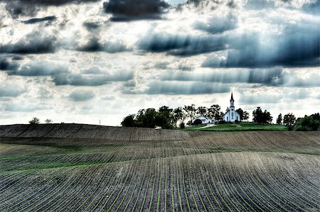 painterly - A lone chapel with sun rays shining down and surrounded by rows of freshly planted corn Photographie de stock - Aubaine LD & Abonnement, Code: 400-07111327
