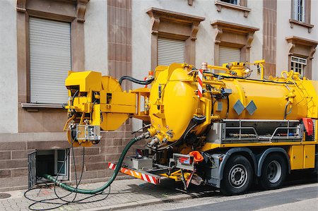 pipework - Sewerage truck on street working - clean up sewerage overflows, cleaning pipelines and potential pollution issues from an modern building. Stock Photo - Budget Royalty-Free & Subscription, Code: 400-07111534