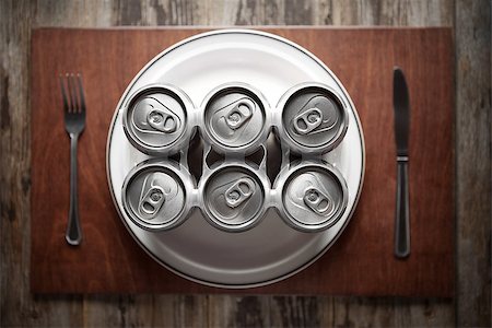 six-pack - Conceptual image representing alcoholism on a funny way using a six-pack of beer cans for dinner. Stock Photo - Budget Royalty-Free & Subscription, Code: 400-07111584