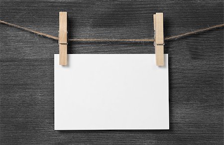 dirty photo frame - paper card hanging on the rope, blank Stock Photo - Budget Royalty-Free & Subscription, Code: 400-07112329