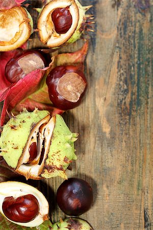 Autumn leaves and horse chestnut on the old board. Stock Photo - Budget Royalty-Free & Subscription, Code: 400-07112837