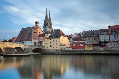 simsearch:400-06138816,k - Long exposure image of unesco heritage and historic bavarian city Regensburg with cathedral and old stone bridge over river danube in Germany. Photographie de stock - Aubaine LD & Abonnement, Code: 400-07113784