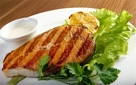 delicious grilled salmon steak with vegetables . Shallow depth-of-field Stock Photo - Budget Royalty-Free & Subscription, Code: 400-07124394