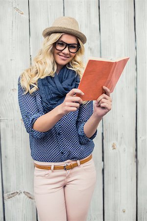 simsearch:400-04722731,k - Cheerful fashionable blonde reading outdoors on wooden background Stock Photo - Budget Royalty-Free & Subscription, Code: 400-07126948