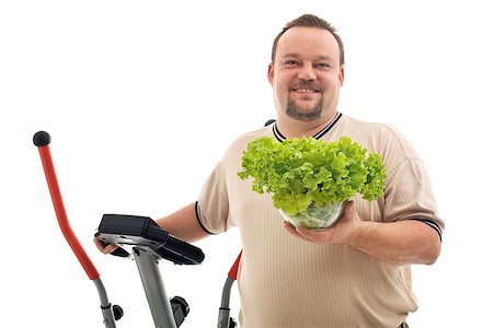fat man exercising - Overweight man with healthy choices - exercise and fresh food, isolated Stock Photo - Budget Royalty-Free & Subscription, Code: 400-07122947