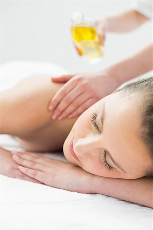 Close up of a beautiful woman enjoying oil massage at beauty spa Stock Photo - Budget Royalty-Free & Subscription, Code: 400-07136374