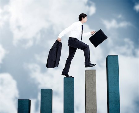 simsearch:6109-06684997,k - Young businessman climbing grey and blue steps on sky background Stock Photo - Budget Royalty-Free & Subscription, Code: 400-07138055
