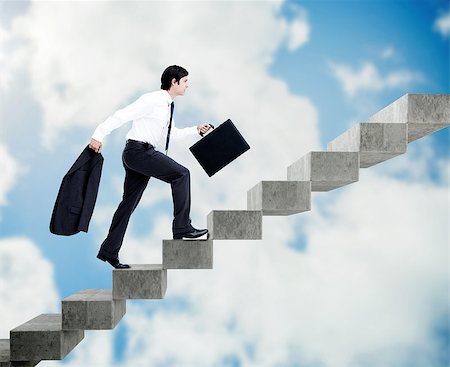 simsearch:6109-06684997,k - Young businessman climbing grey stairs on sky background Stock Photo - Budget Royalty-Free & Subscription, Code: 400-07138053